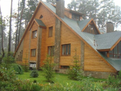 Фото дома, обшитого деревянным блок хаусом
